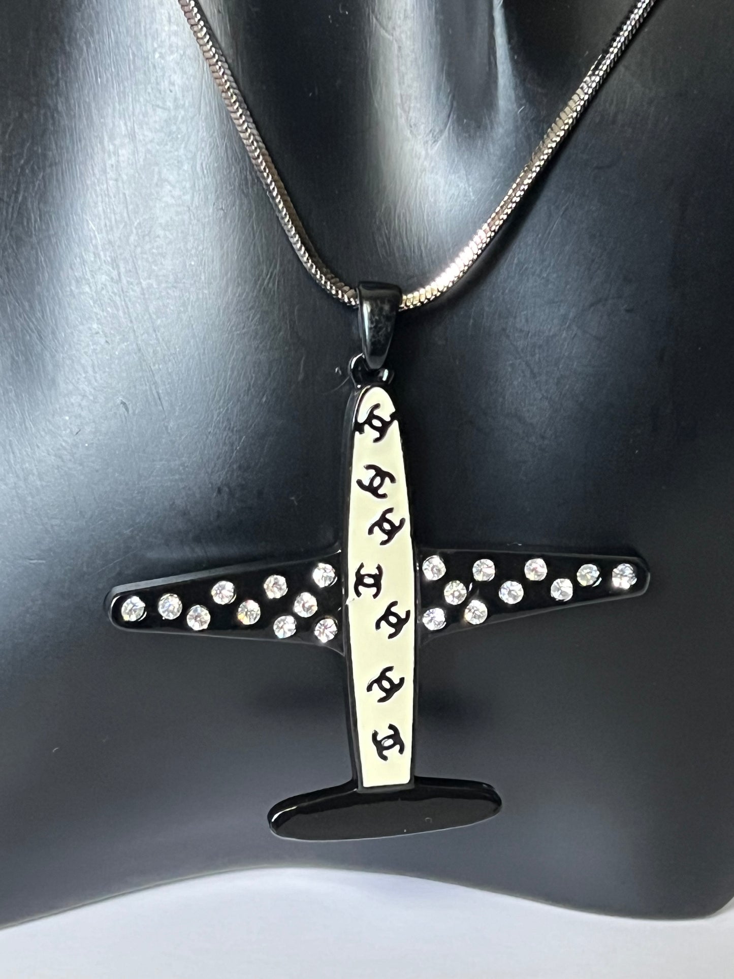 Silver Necklace with a Black and White Airplane Pendant