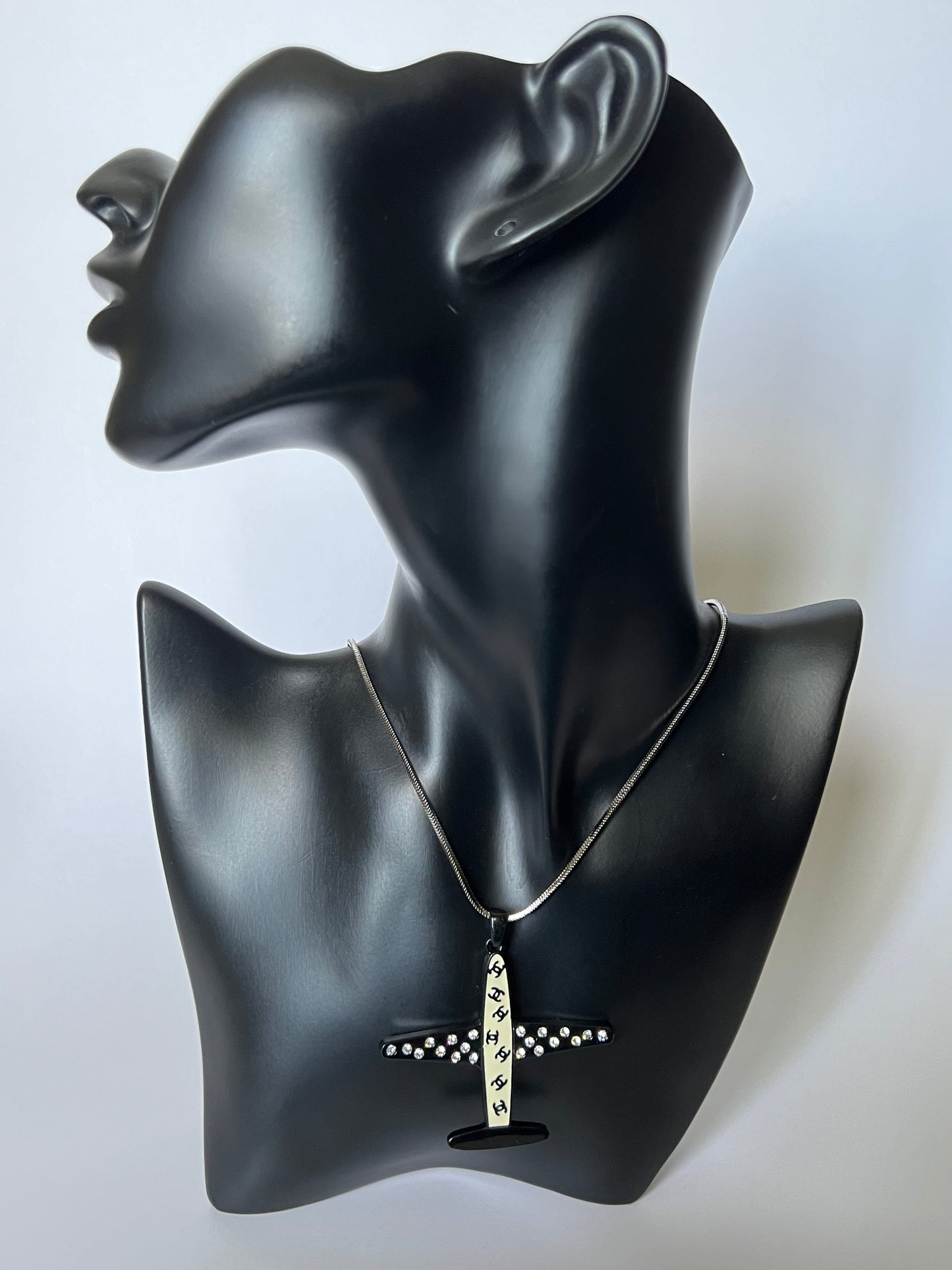 Silver Necklace with a Black and White Airplane Pendant