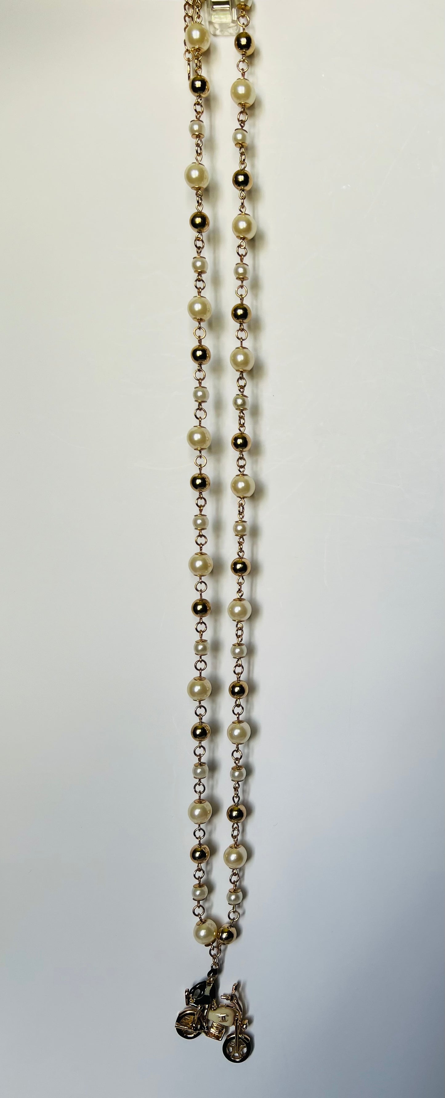 Long Gold and Pearl Necklace with Bike Pendant