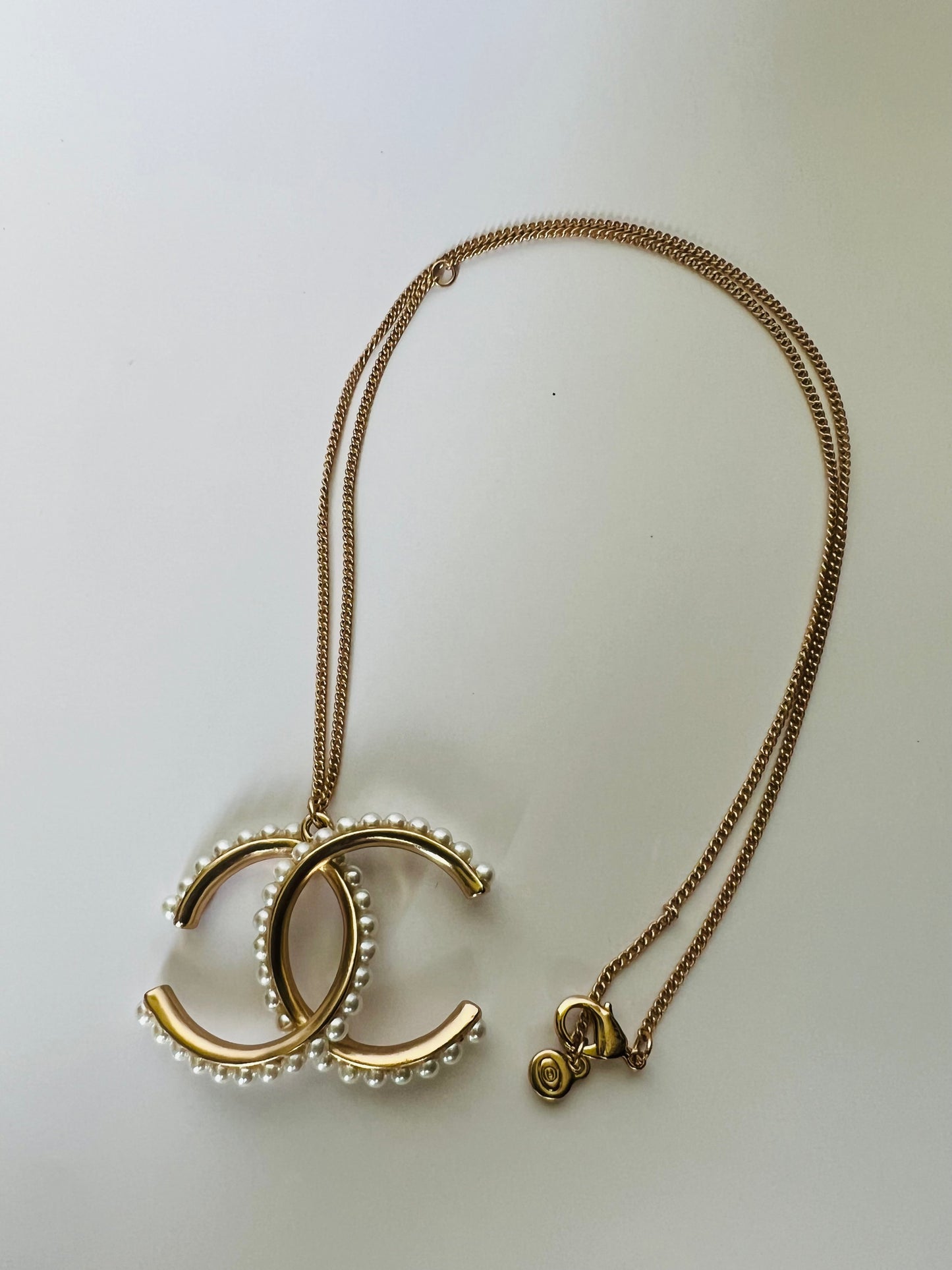 Long Golden Necklace with a Large Pendant