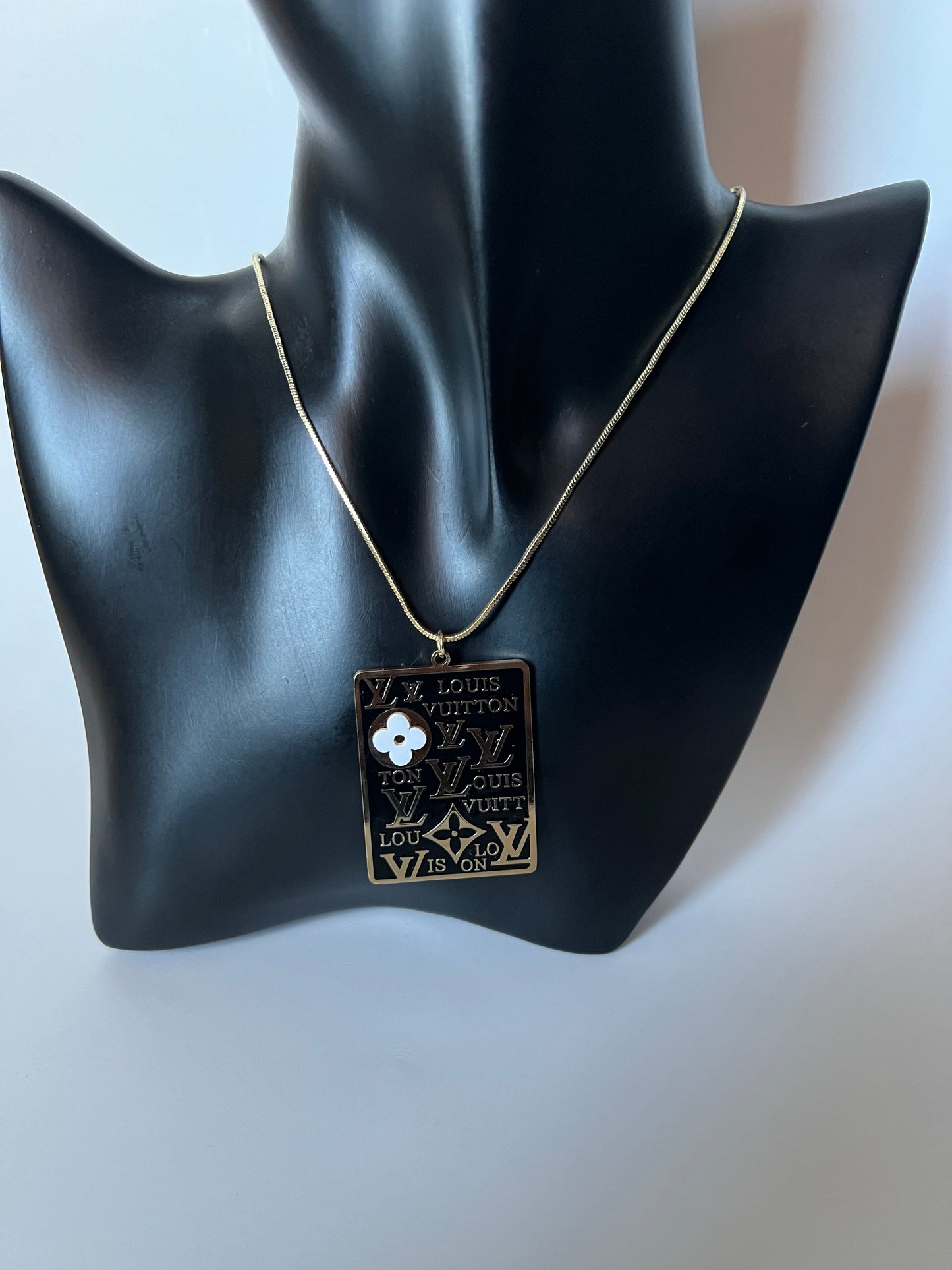 Long Golden Necklace with Black and Gold Pendant